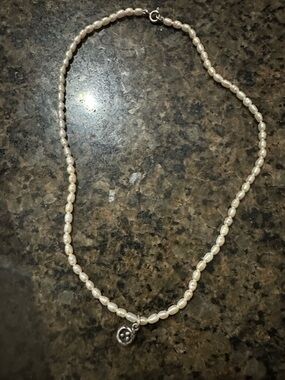 Delicate White Freshwater Pearl Necklace with Silver Flower Charm